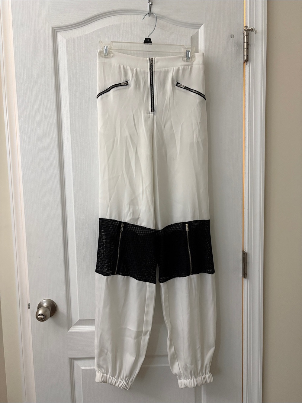 High-Waist White Jogger Jumpsuit with Black Mesh Panels